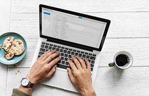 Man typing on laptop